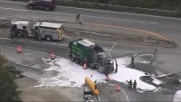 A garbage truck covered in fire retardant on Route 120 in Taunton, Massachusetts, on Tuesday, Sept. 24, 2024.