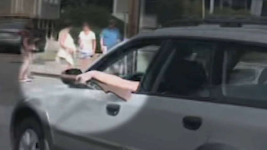 A driver brandishing what her lawyer later described at a BB gun during an incident at Wakefield, Massachusetts' inaugural Porchfest on Sunday, Sept. 8, 2024.