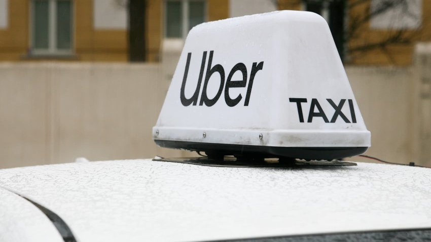 The Uber logo is seen in the rain in Krakow, Poland, on January 6, 2024.