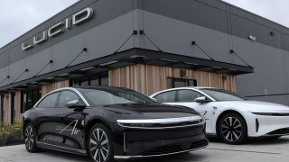 Brand new Lucid electric cars sit parked in front of a Lucid Studio showroom on May 24, 2024 in San Francisco, California. 