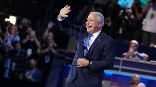 Democratic vice presidential candidate Minnesota Gov. Tim Walz arrives to speak on stage during the third day of the Democratic National Convention at the United Center on August 21, 2024 in Chicago, Illinois. 