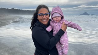 Alejandra Rojas smiles with her newborn baby.