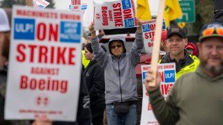 Workers picket outside a Boeing Co. facility during a strike in Everett, Washington, US, on Monday, Sept. 16, 2024. Boeing Co. factory workers walked off the job for the first time in 16 years, halting manufacturing across the planemaker’s Seattle hub after members of its largest union voted overwhelmingly to reject a contract offer and go on strike.