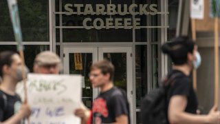 Demonstrators protest outside a closed Starbucks Corp. location at 505 Union Station in Seattle, Washington, US, on Saturday, July 16, 2022. 