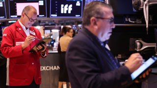 Traders work on the floor of the New York Stock Exchange during morning trading in New York City. 