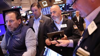 Traders work on the floor of the New York Stock Exchange during morning trading in New York City. 