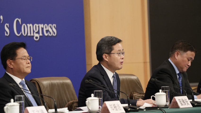 Lan Fo’an, China’s finance minister, center, speaks as Zheng Shanjie, chairman of the National Development and Reform Commission (NDRC), left, and Pan Gongsheng, governor of the People’s Bank of China (PBOC), listen during a news conference on the sidelines of the National People’s Congress in Beijing, China, on Wednesday, March 6, 2024.