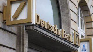 A sign for Deutsche Bank AG at a bank branch in the financial district of Frankfurt, Germany, on Thursday, Feb. 2, 2023. 