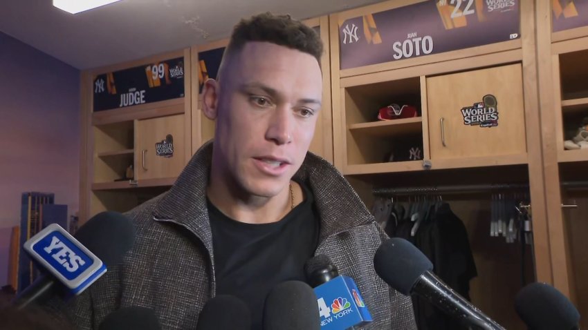 Aaron Judge in the locker room with reporters