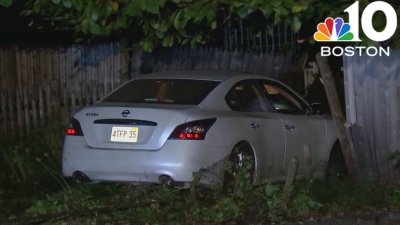 Car crashes through yard in Dedham