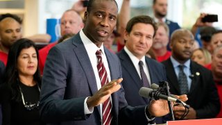 Florida Surgeon General Dr. Joseph Ladapo gestures as speaks to supporters and members of the media before a bill signing by Gov. Ron DeSantis Thursday, Nov. 18, 2021, in Brandon, Fla.