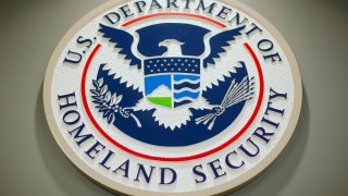 The Department of Homeland Security logo is seen during a news conference in Washington, Feb. 25, 2015.