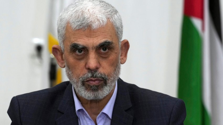 FILE – Yahya Sinwar, head of Hamas in Gaza, chairs a meeting with leaders of Palestinian factions at his office in Gaza City, on April 13, 2022.