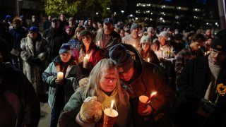 The crowd gathers during a candlelight vigil, honoring the victims of the Lewiston shootings.