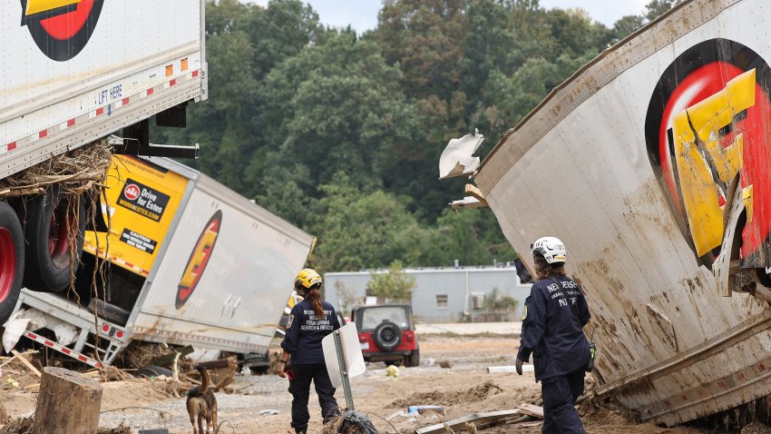 ASHEVILLE, NORTH CAROLINA – OCTOBER 04: Members of the FEMA Urban Search and Rescue Task Force search a flood damaged area with a search canine in the aftermath of Hurricane Helene along the Swannanoa River on October 4, 2024 in Asheville, North Carolina. At least 215 people were killed in six states in the wake of the powerful hurricane which made landfall as a Category 4. President Joe Biden ordered the deployment of 1,000 active duty U.S. soldiers to assist with storm relief efforts in what is now the deadliest U.S. mainland hurricane since Hurricane Katrina.