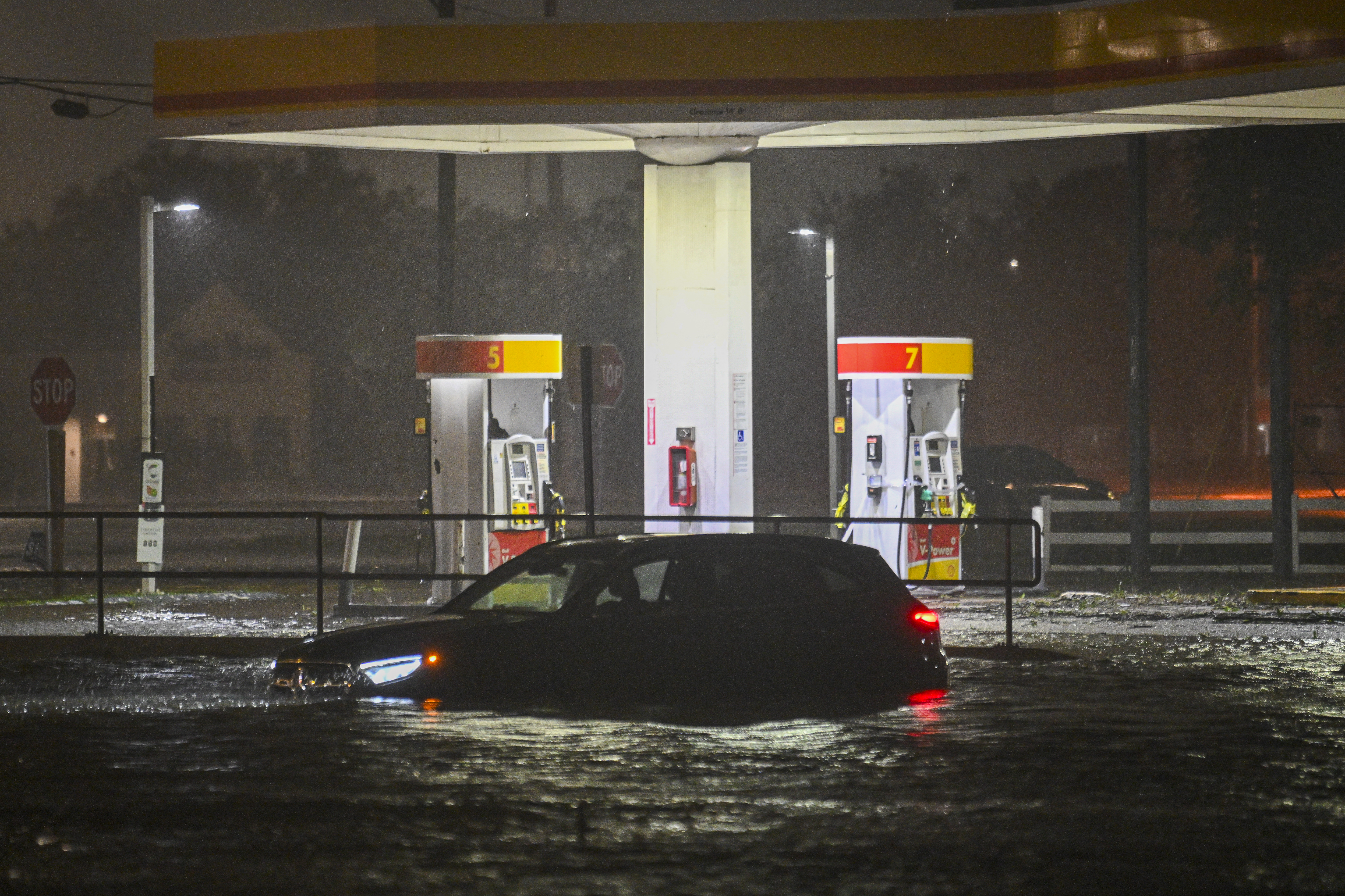 A vehicle is stranded on a water-flooded street after Hurricane Milton made landfall in Brandon, Florida on October 9, 2024.