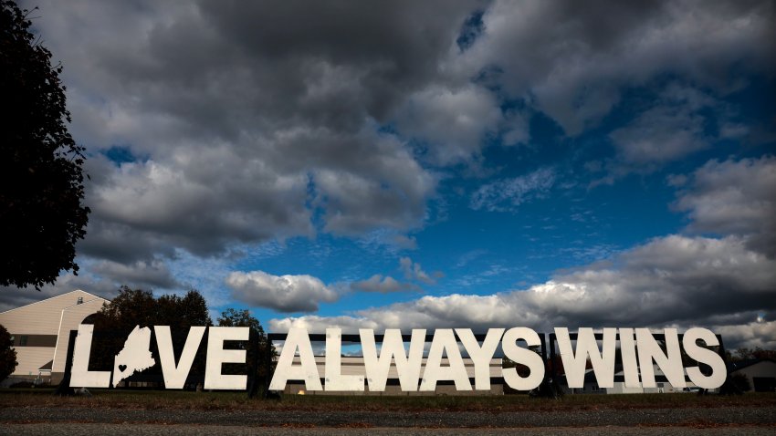 Lewiston, ME – October 2: A “Love Always Wins” message lines Mollison Way near Just-In-Time Recreation. The bowling alley was devastated on October 25, 2023, the night of the state’s deadliest mass shooting that claimed 18 lives at Just-In-Time and Schemengees Bar & Grille. (Photo by Craig F. Walker/The Boston Globe via Getty Images)