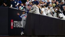 NEW YORK, NY - OCTOBER 29: Mookie Betts #50 of the Los Angeles Dodgers makes a leaping catch against the wall during Game 4 of the 2024 World Series presented by Capital One between the Los Angeles Dodgers and the New York Yankees at Yankee Stadium on Tuesday, October 29, 2024 in New York, New York. (Photo by Daniel Shirey/MLB Photos via Getty Images)