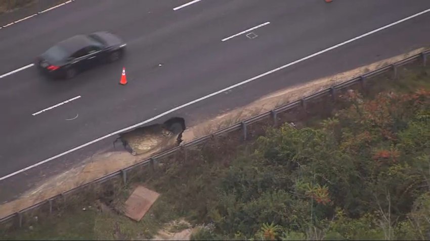 A sinkhole closed a lane on I-495 in Haverhill, Massachusetts, on Monday.