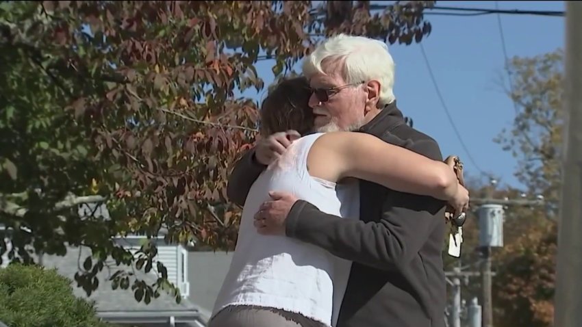 Tom Creamer and Kate Sheer embrace after being reunited months after Sheer helped save Creamer’s life using CPR.