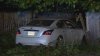 Car crashes through yard, fence in Dedham