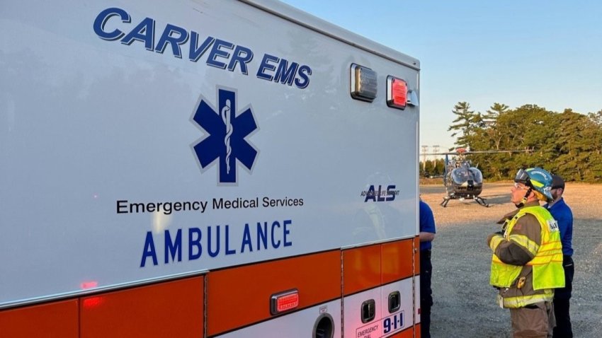 First responders, including a medical helicopter, at the scene of a serious crash involving a motorcycle and a truck in Carver, Massachusetts, on Friday, Oct. 11, 2024.