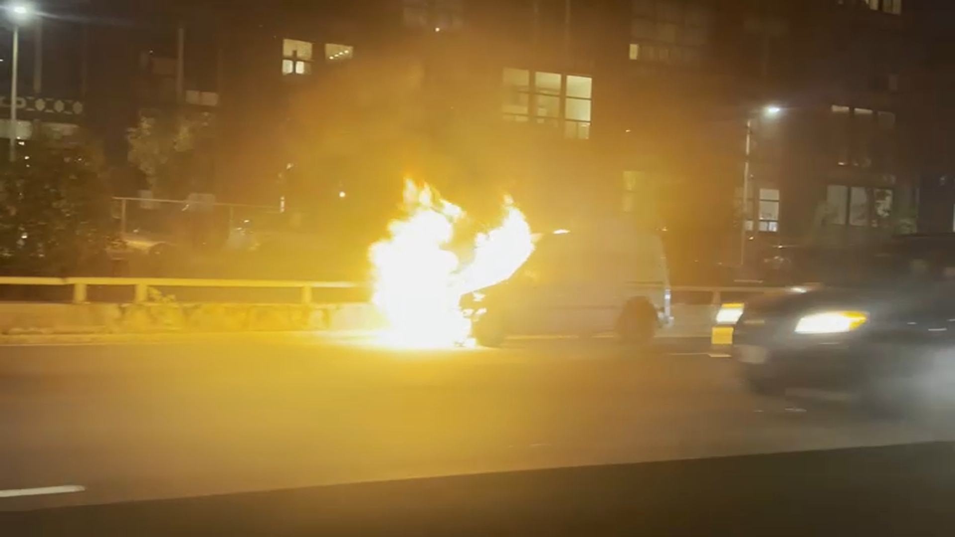 A burning van on I-90 in Boston on Tuesday, Oct. 29, 2024.