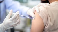 Close-up of a doctor administering a vaccine