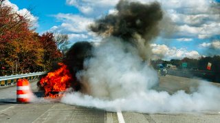 A vehicle fire on I-90 in Westborough, Massachusetts, on Wednesday, Oct. 9, 2024.