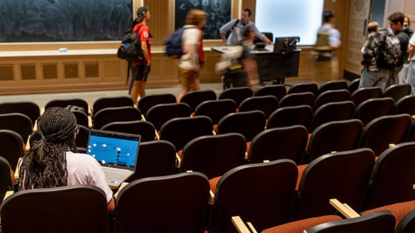 A student student sits in a lecture hall while class is being dismissed at the University of Texas at Austin on February 22, 2024 in Austin, Texas.