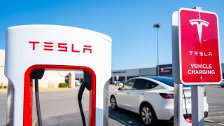 Tesla Supercharging stations are seen in a parking lot in Austin, Texas, on Sept. 16, 2024.