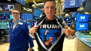 Trader Walter Lundon shows off his shirt featuring US President-elect Donald Trump, on the floor of the New York Stock Exchange (NYSE) in New York City on November 6, 2024. 