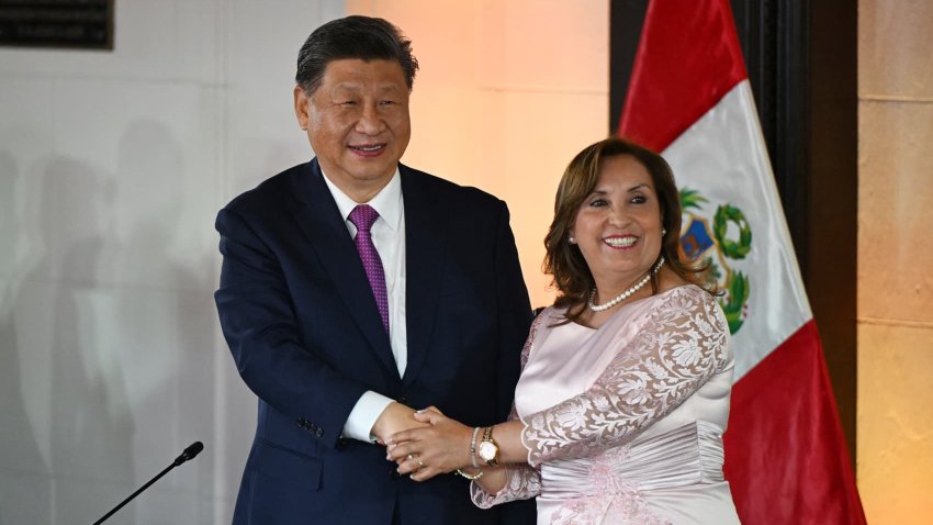 China’s President Xi Jinping (L) and Peru’s President Dina Boluarte shake hands during a meeting at the government palace in Lima on November 14, 2024, on the sidelines of the Asia-Pacific Economic Cooperation (APEC) Summit. 