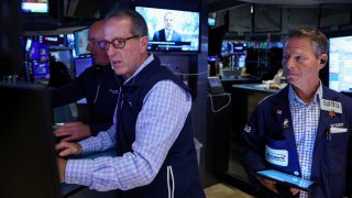 A specialist trader works at his post on the floor at the New York Stock Exchange on Nov. 27, 2024.