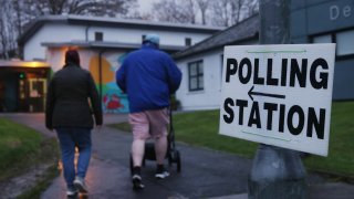 People arrive at Delgany National School to cast their votes during the Irish general election on November 29, 2024 in Wicklow, Ireland.