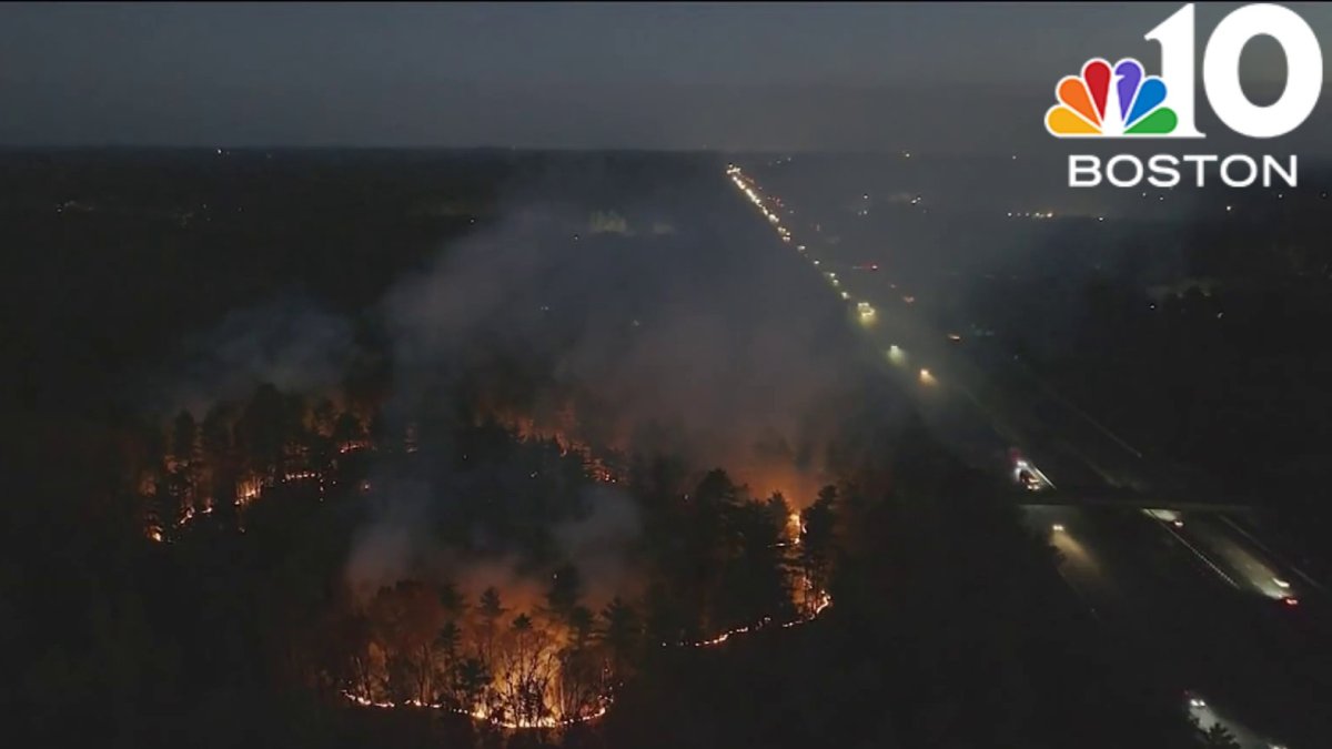 Battling brush fire burns near highway in Mass. state park – NBC Boston