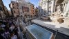 Tourists in Rome now have a walkway to visit the Trevi Fountain but can't toss coins