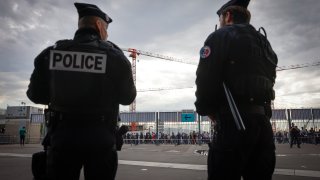 FILE – Police officers stand guard ahead the UEFA Nations League soccer match between France and Denmark at the Stade de France in Saint Denis near Paris, France, Friday, June 3, 2022.