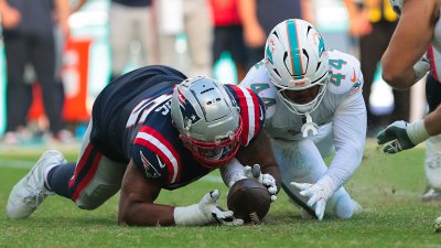 Patriots offensive lineman Demontrey Jacobs and Dolphins defensive end Chop Robinson