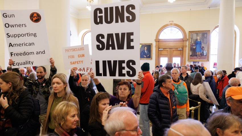 AUGUSTA, ME – JANUARY 3: Gun rights advocates hold signs amongst the gun reform and gun safety supporters at the State House as lawmakers return for the start of the second regular session of the 131st Legislature on Wednesday, January 3, 2024. (Staff photo by Brianna Soukup/Portland Press Herald via Getty Images)