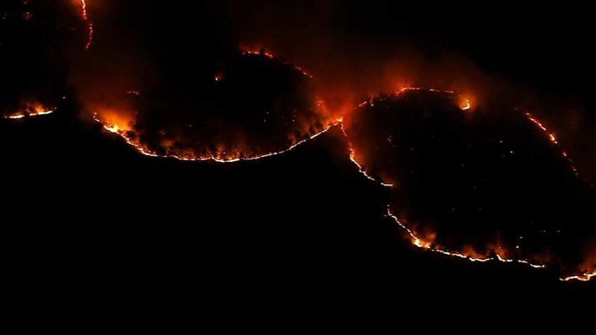 A brush fire burning in Lynn, Massachusetts, on the night of Friday, Nov. 8, 2024.