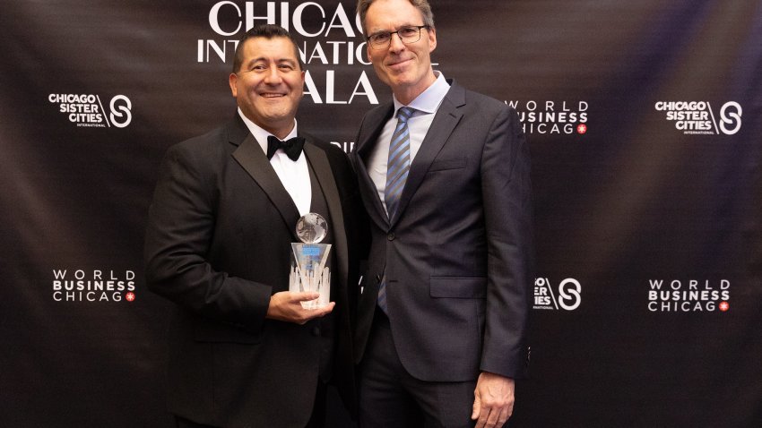 Martin Cabrera with an award from World Business Chicago.