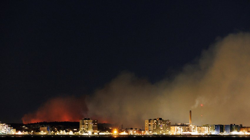 Photos show the large brush fire in Lynn Woods throwing smoke toward downtown Lynn, Swampscott and Nahant as Revere Beach sits in the foreground. Photographed from Winthrop.