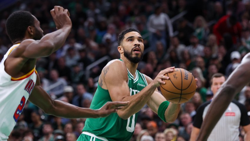 Nov 6, 2024; Boston, Massachusetts, USA; Boston Celtics forward Jayson Tatum (0) shoots during the first half against the Golden State Warriors at TD Garden. Mandatory Credit: Paul Rutherford-Imagn Images