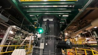 Vicinity Energy is connecting its new carbon-free eBoiler to 26 miles of underground pipes in Boston to provide steam to Emerson College and IQHQ