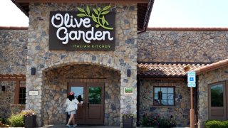 A sign hangs on the front of an Olive Garden restaurant on June 22, 2023 in Chicago, Illinois.