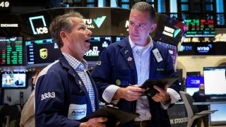 A specialist trader works at his post on the floor at the New York Stock Exchange (NYSE) in New York City.