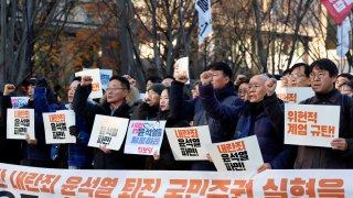 People take part in a rally to demand South Korean President Yoon Suk Yeol’s removal from power, in Seoul, South Korea, December 4, 2024.