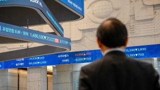 A visitor looks at screens at the Korea Exchange (KRX) headquarters in Seoul, South Korea, on Wednesday, Dec. 4, 2024.