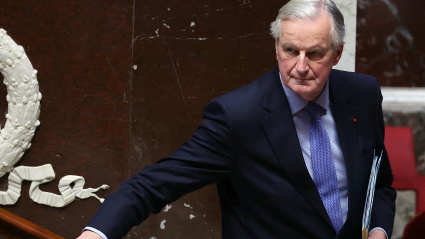 French Prime Minister Michel Barnier leaves after delivering a speech during the debate prior to the no-confidence votes on his administration at the National Assembly in Paris on December 4, 2024.